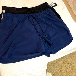 NWT! Ideology athletic shorts. 2 pairs of shorts. 1 black 1 navy. Size Largee
